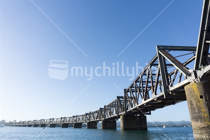 Tauranga harbour with steel railway bridge crossing