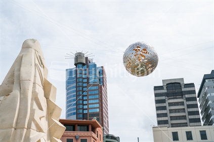 WELLINGTON, NEW ZEALAND - OCTOBER 1 2018; Silver steel globe comprising of and called Ferns shaped floating above Civic Square by artist Neil dawson installed 1998.