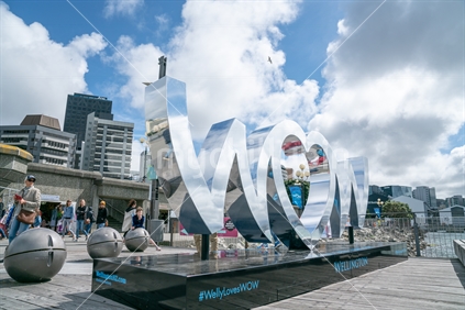 WELLINGTON, NEW ZEALAND - SEPTEMBER 29 2018; Shiny reflective WOW sign promoting the event on Wellington waterfront
