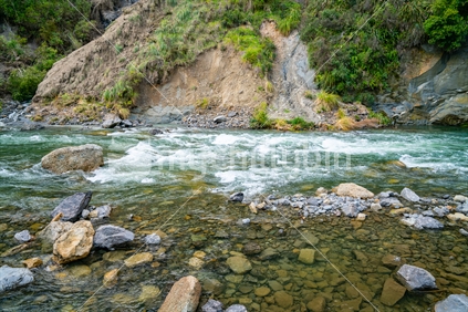 Water rushing over rocky bottom of Rangatikei River near Taihape, New Zealand.