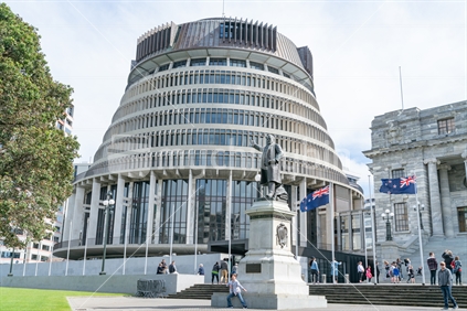 WELLINGTON, NEW ZEALAND - OCTOBER 1 2018; Capital city governmant buildings including circular conical shaped building known as Beehive with statue of Richard John Seddon a former famous politician pointing the way with right hand