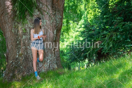 Teenager in natural park of McLaren Falls Park, Tauranga New Zealand.