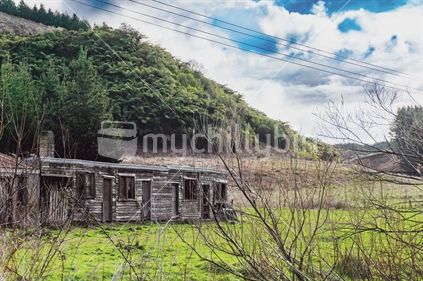Typical New Zealand old farm buildings left to deteriorate make a rustic old-world image.