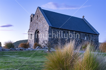 Historic Church of Good Sheppard famouns tourist destination on shore of Lake Tekapo at twilight in New Zealand.