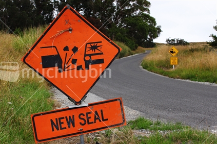 New seal warning road sign on rural school bus route road.
