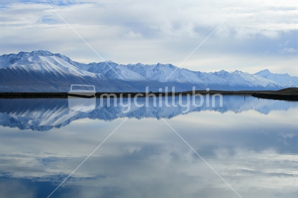 Southern Alps reflected in the Lake Pukaki  