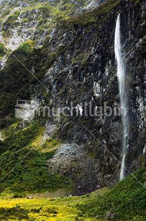 Waterfall running down the side of mountain