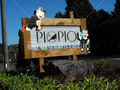 Piopio shows their support for 2011 Rugby World Cup with two All Blacks rugby player figures on their welcome sign.