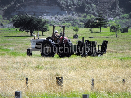 Tractor about to mow golf course at Mokau
