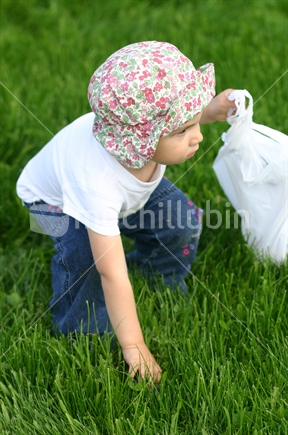 Little girl hunting for easter eggs