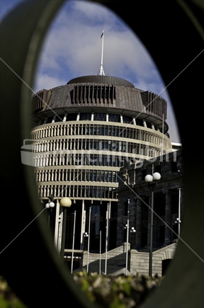 Looking at The Beehive and Parliament Building through a ring, Wellington, New Zealand
