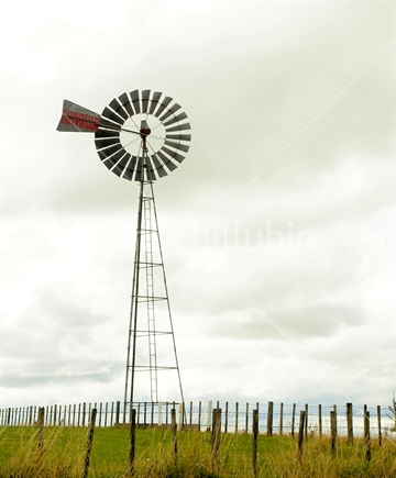 Rural farm windmill scene in Fielding, New Zealand. 
