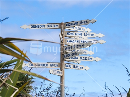 Sign to all points of the compass at Tauranga Bay Cape Foulwind.