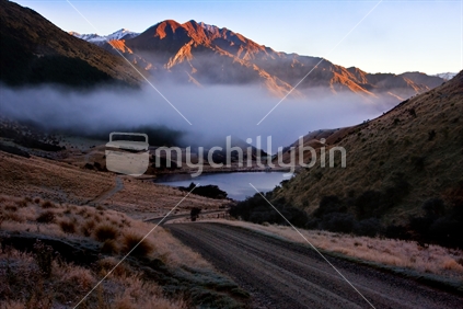 Misty road leading to lake in Queenstown, New Zealand