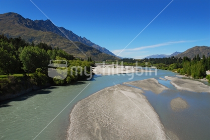 Looking down the Shotover River to the Remarkables (left), South Island, New Zealand
