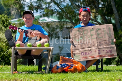 Young entrepreneurs selling New Zealand green apples - $2 for a bag