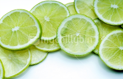 A group of lime slices on a white background