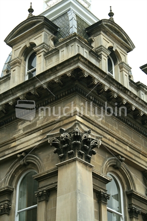 Detailing the top corner of an historic stone building in the Octagon, Dunedin.