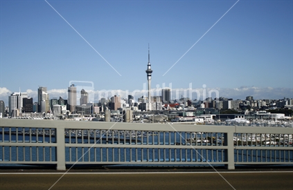View of Auckland CBD, Sky tower and marina from the harbour bridge.