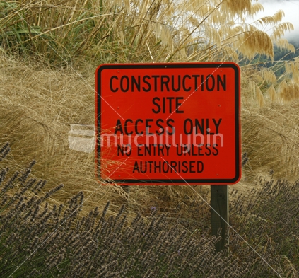Sign post at the entrance to a construction site.