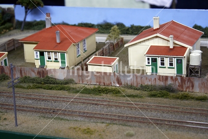 A model railway display complete with miniature trees and buildings.