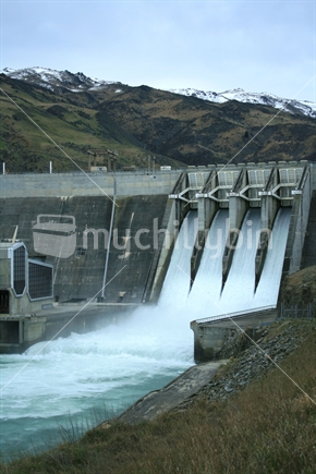 All four flood gates opened on Clyde Dam to release excess water from snow melt, situated in Central Otago, South Island, New Zealand
