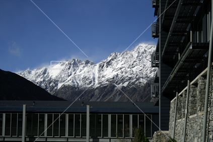 Snow capped mountains, framed by a modern architectural building, in McKenzie Country, South Island, New Zealand. 