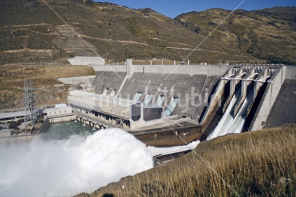 Clyde Dam with flood gates open, releasing water from Lake Dunstan.