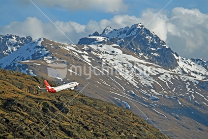 Qantas airline, taking off from Queenstown airport.