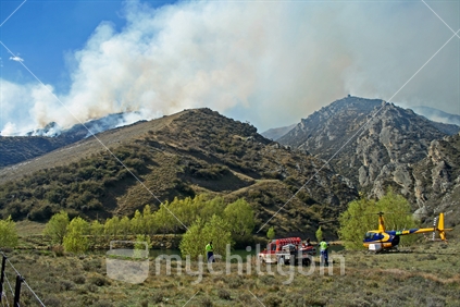 Clouds of smoke billowing from a controlled burnoff in Dunstan gorge, Central Otago.