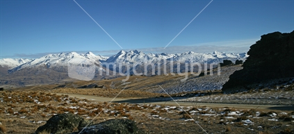 Distant snow capped mountains viewed from Duffers Saddle, Nevis, Central Otago.