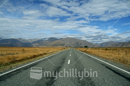 Converging lines on the main highway leading toward Lindis Pass, Mackenzie Country.