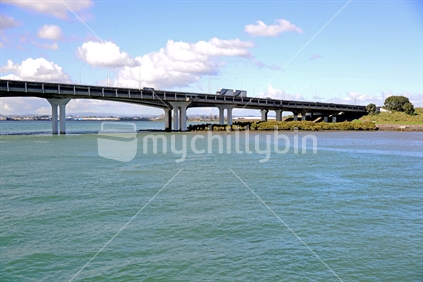 Mangroves under, and Mangere bridge over; Truck and trailer unit, crossing.