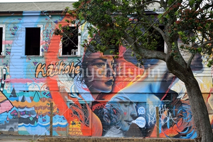 The wall of the derelict Kaikohe Hotel, covered with beautiful graffiti art by unknown artist.  The hotel is said to soon be demolished.