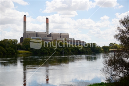 Huntly Power station reflected in a very calm Waikato River.