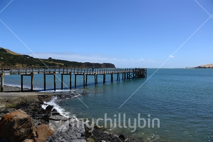Omapere wharf on the Hokianga harbour, overlooking North and South Heads.  A popular tourist destination.