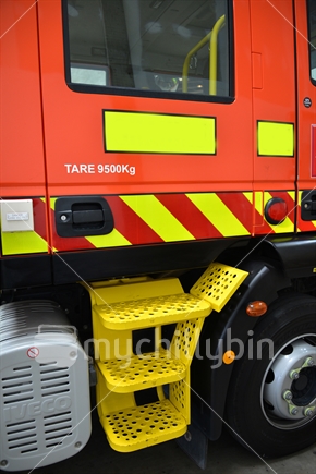 Rear drivers side door and steps, of a fire truck, emergency service vehicle.