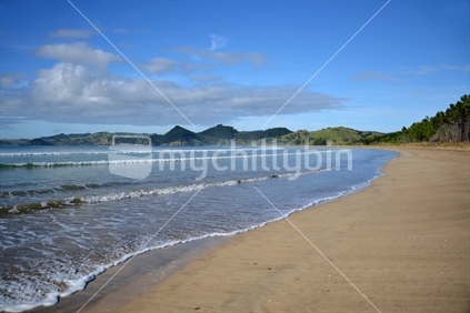 Ebbing tide on Whananaki Beach