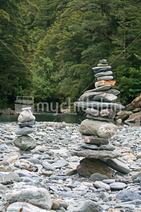 2 cairns built from stones from the riverbed.