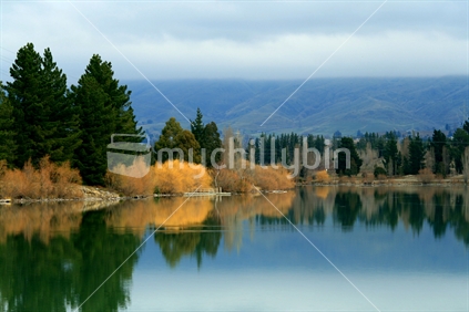 Early spring reflections on Lake Dunstan in Central Otago, New Zealand
