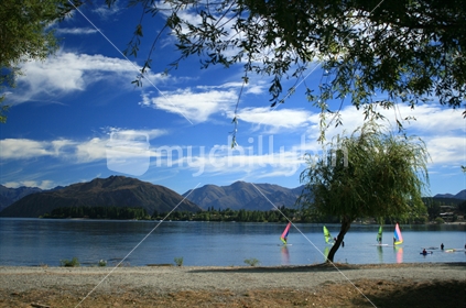 Windsurfers on the calm waters of Lake Wanaka, Central Otago, 