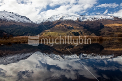 Lake reflection at outskirts of Mount Aspiring National Park, New Zealand