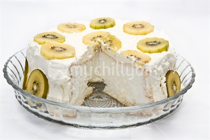 Image of pavlova with Golden Kiwifruit with slice cut out