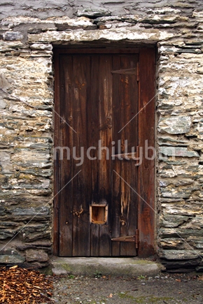 Schist Stone Wall and Wooden Doorway, South Island