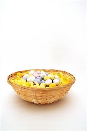 Small Coloured Easter Eggs in a basket