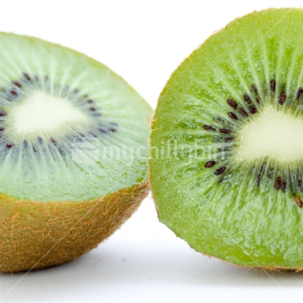 Juicy kiwifruit cut in half with a white background cropped