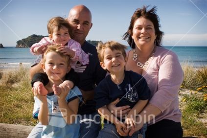 Family of five at beach, family portrait