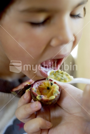Young boy eats a healthy snack 