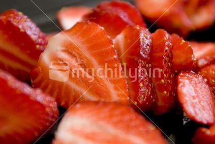 A plate of freshly sliced strawberries