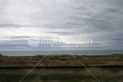 Railway, golden grass and the horizon